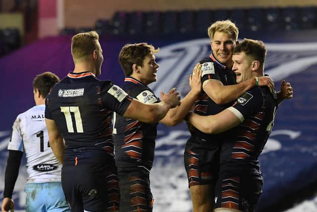 Edinburgh players celebrate the game's opening try by Magnus Bradbury, right. Picture: Ross Parker/SNS