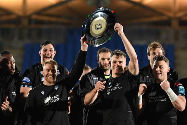 Glasgow Warriors' Kyle Steyn and Stafford McDowall lift the Italian-Scottish Shield for 2022-23 season after the club's win over Connacht at Scotstoun on April 22, 2023. (Photo by Ross MacDonald / SNS Group)