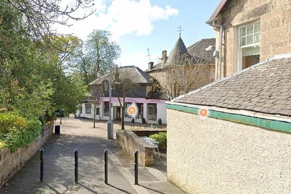 The two were found dead in a property on Station Road, Milngavie (Photo: Google Maps).