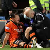 Dundee United's Marc McNulty was injured in the Premier Sports Cup quarter-final defeat to Hibs at Tannadice.  (Photo by Alan Harvey / SNS Group)