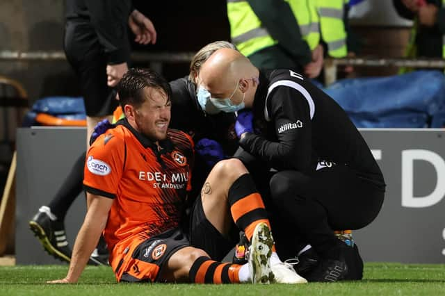 Dundee United's Marc McNulty was injured in the Premier Sports Cup quarter-final defeat to Hibs at Tannadice.  (Photo by Alan Harvey / SNS Group)