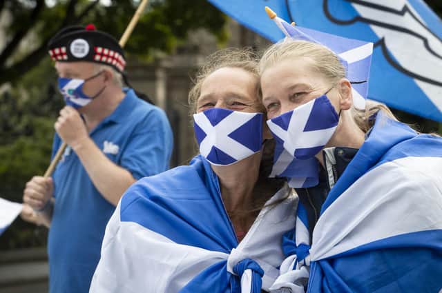 Members from All Under One Banner take part in a static demonstration for Scottish independence outside the Scottish Parliament in Edinburgh earlier this year