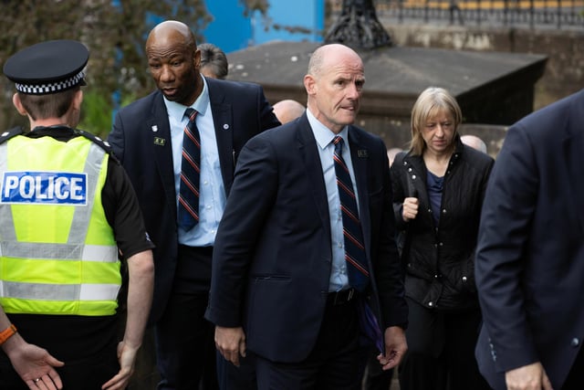 Former Rangers players Marvin Andrews (L) and Gordon Durie arrive at the funeral of Rangers kitman Jimmy Bell
