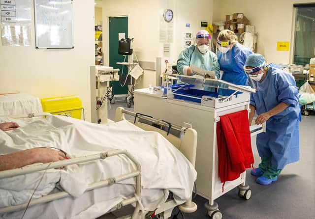 Staff attending to a patient in the ICU. Picture: Lisa Ferguson