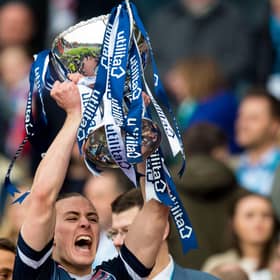 Jackson Irvine lifts the League Cup with Ross County in 2016.