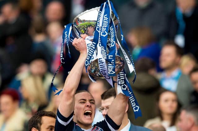 Jackson Irvine lifts the League Cup with Ross County in 2016.