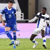 Bosnia-Herzegovina's midfielder Rade Krunic (L) and Finland's midfielder Glen Kamara vie for the ball during the FIFA World Cup Qatar 2022 qualification football match Finland v Bosnia and Herzegovina in Helsinki on March 24, 2021. (Photo by JUSSI NUKARI/LEHTIKUVA/AFP via Getty Images)