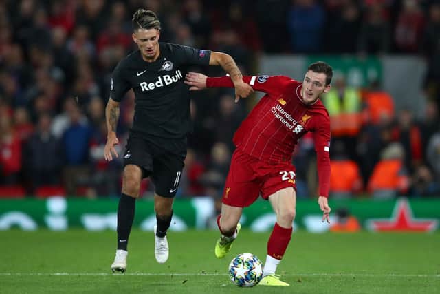 Andy Robertson of Liverpool and Dominik Szoboszlai of Red Bull Salzburg during the UEFA Champions League group E match between Liverpool FC and RB Salzburg at Anfield on October 02, 2019. (Photo by Clive Brunskill/Getty Images)