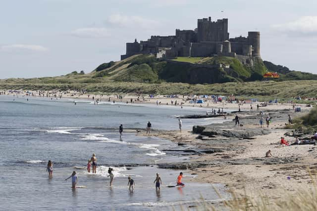 People enjoying the sunshine at Bamburgh Castle in Northumberland.
Pic: Owen Humphreys