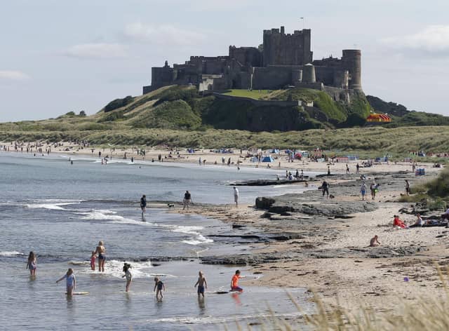 People enjoying the sunshine at Bamburgh Castle in Northumberland.
Pic: Owen Humphreys