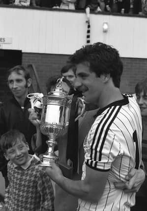 St Mirren's Fitzpatrick celebrates with the Scottish Cup in 1987.