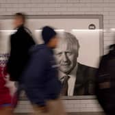 The face of former British prime minister Boris Johnson on an advertising hoarding at Westminster tube station in London. Picture: AP Photo/Alberto Pezzali
