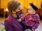 Nicola Sturgeon meets Amelia Mackinnon, nine months, last year at Govan Help, a charity which supports vulnerable children, parents and families (Picture: Peter Summers/Getty Images)