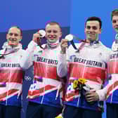 Luke Greenbank, Adam Peaty, James Guy and Duncan Scott pose with their medals after the final of the men's 4x100m medley relay