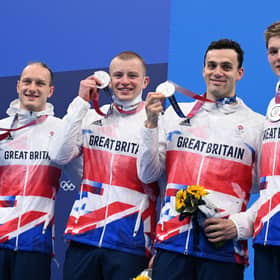 Luke Greenbank, Adam Peaty, James Guy and Duncan Scott pose with their medals after the final of the men's 4x100m medley relay