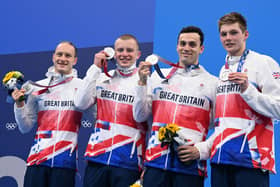 Luke Greenbank, Adam Peaty, James Guy and Duncan Scott pose with their medals after the final of the men's 4x100m medley relay