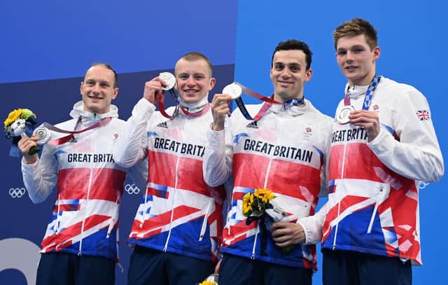 Luke Greenbank, Adam Peaty, James Guy and Duncan Scott pose with their medals after the final of the men's 4x100m medley relay