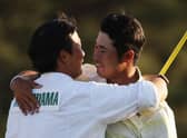 Hideki Matsuyama hugs his caddie, Shota Hayafuji, on the 18th green after winning the 2021 Masters at Augusta National Golf Club. Picture: Kevin C. Cox/Getty Images.