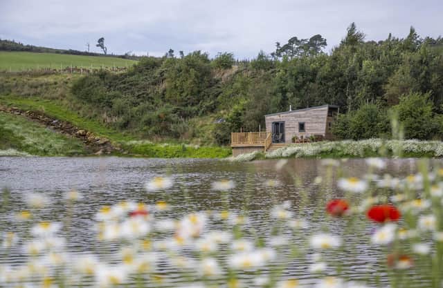 The green getaway sits on the banks of its own lochan.