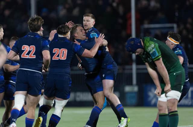 Edinburgh's Ben Healy (R) is swarmed by team-mates after kicking the winning drop goal against Connacht at the Hive Stadium. (Photo by Ross Parker / SNS Group)