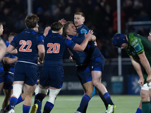 Edinburgh's Ben Healy (R) is swarmed by team-mates after kicking the winning drop goal against Connacht at the Hive Stadium. (Photo by Ross Parker / SNS Group)