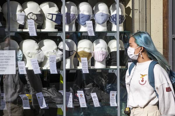 Face masks and social distancing are still with us, so shouldn't we be in a Covid tier? (Picture: Jane Barlow/PA Wire)