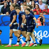 Scotland's scrum-half George Horne (R) celebrates with teammates after scoring a try against Tonga.