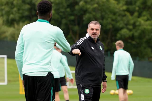 Celtic manager Ange Postecoglou elbow bumps with Odsonne Edouard  at the end of Friday's training session at their  Lennoxtown base - one of the practices initiated to limit close contact during the Covid-19 pandemic. (Photo by Craig Williamson / SNS Group)
