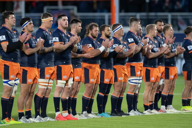 Both teams participated in a minute's applause for Tom Smith before the match.  (Photo by Ross Parker / SNS Group)