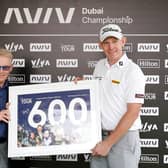 Stephen Gallacher of Scotland receives a framed print from European Tour CEO Keith Pelley to commemorate 600 starts on the European Tour ahead of the AVIV Dubai Championship at Jumeirah Golf Estates. Picture: Oisin Keniry/Getty Images.
