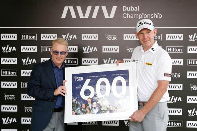 Stephen Gallacher of Scotland receives a framed print from European Tour CEO Keith Pelley to commemorate 600 starts on the European Tour ahead of the AVIV Dubai Championship at Jumeirah Golf Estates. Picture: Oisin Keniry/Getty Images.