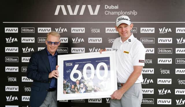 Stephen Gallacher of Scotland receives a framed print from European Tour CEO Keith Pelley to commemorate 600 starts on the European Tour ahead of the AVIV Dubai Championship at Jumeirah Golf Estates. Picture: Oisin Keniry/Getty Images.