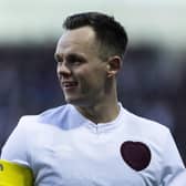 Lawrence Shankland scored twice for Hearts as they overcame Motherwell 2-1.