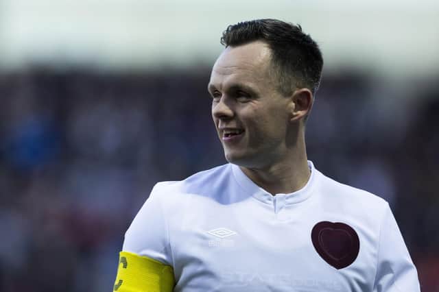 Lawrence Shankland scored twice for Hearts as they overcame Motherwell 2-1.