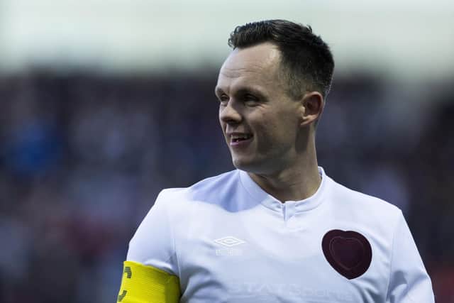 Lawrence Shankland scored twice for Hearts as they overcame Motherwell 2-1.