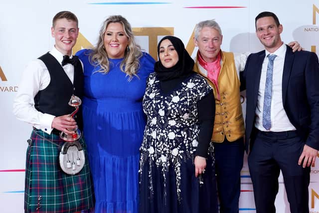 Peter Sawkins, Laura Adlington and other cast members of The Great British Bake off in the press room after winning the Challenge Show award at the National Television (Image credit: Ian West/PA Wire)