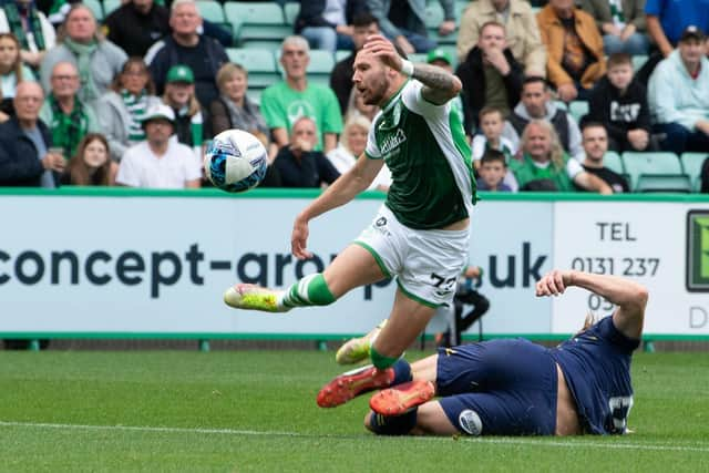 Kilmarnock's Ash Taylor is sent off for a tackle on Hibs' Martin Boyle.