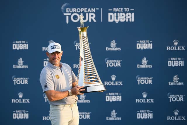 Lee Westwood celebrates with the Race to Dubai Trophy after pipping Matt Fitzpatrick and Patrick Reed in the title battle following the season-ending DP World Tour Championship. Picture: Ross Kinnaird/Getty Images