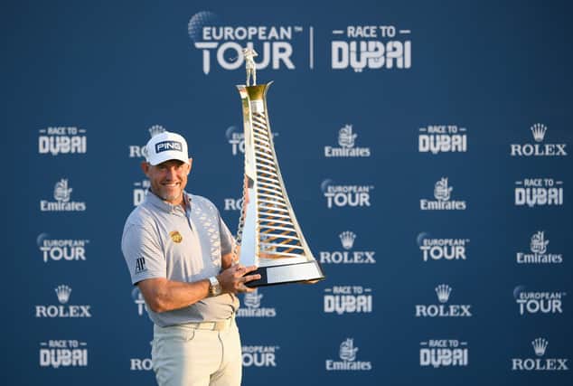 Lee Westwood celebrates with the Race to Dubai Trophy after pipping Matt Fitzpatrick and Patrick Reed in the title battle following the season-ending DP World Tour Championship. Picture: Ross Kinnaird/Getty Images