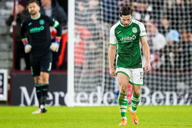 Hibs defender Lewis Stevenson looks dejected after Hearts score. (Photo by Ross Parker / SNS Group)