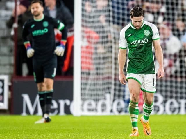 Hibs defender Lewis Stevenson looks dejected after Hearts score. (Photo by Ross Parker / SNS Group)