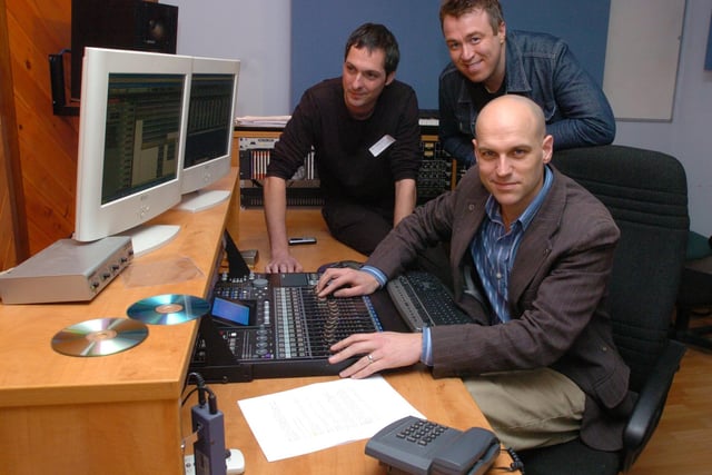 Deputy Chairman of Music Factory Andy Pickles (seated) demonstrates  the workings of a recording studio with Tim Wolliscroft of Swamp Circus (centre) and Mark Smith of  Saint Promotions during  a Music Factory open door day  for businesses .