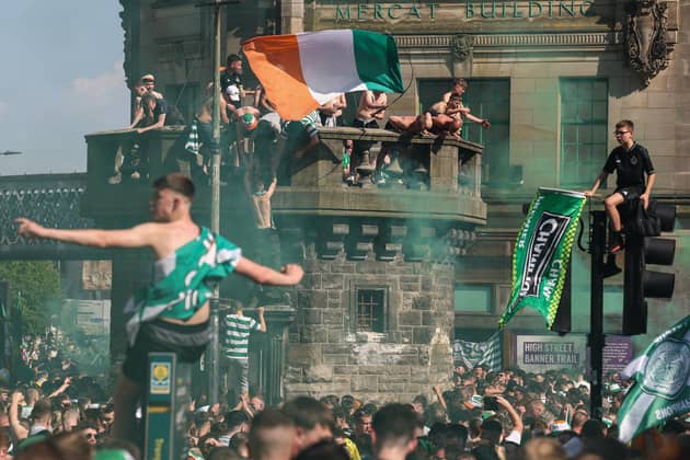Crowds of Celtic fans gather at the Trongate to celebrate their teams 12 title in thirteen years on Saturday. (Photo by Jeff J Mitchell/Getty Images)