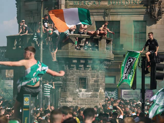 Crowds of Celtic fans gather at the Trongate to celebrate their teams 12 title in thirteen years on Saturday. (Photo by Jeff J Mitchell/Getty Images)
