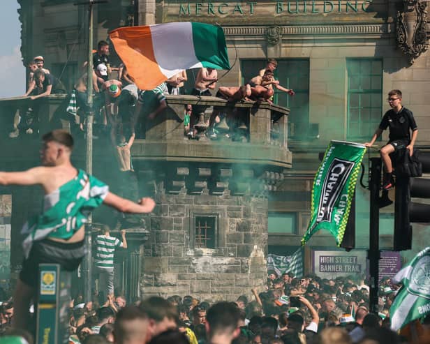 Crowds of Celtic fans gather at the Trongate to celebrate their teams 12 title in thirteen years on Saturday. (Photo by Jeff J Mitchell/Getty Images)