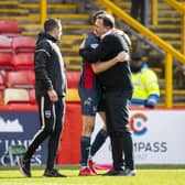 Ross County's Manager Malky Mackay hugs Jack Baldwin at full time.