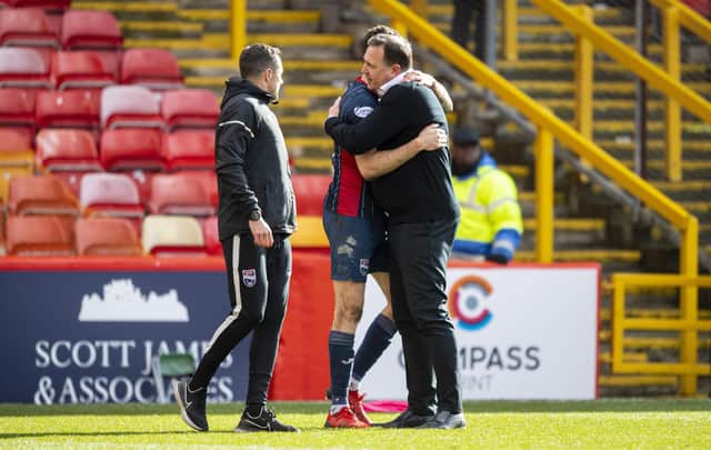 Ross County's Manager Malky Mackay hugs Jack Baldwin at full time.
