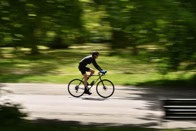 Creating more cycle paths is just one of many things councils can do to help reduce the greenhouse gas emissions driving climate change (Picture: Glyn Kirk/AFP via Getty Images)