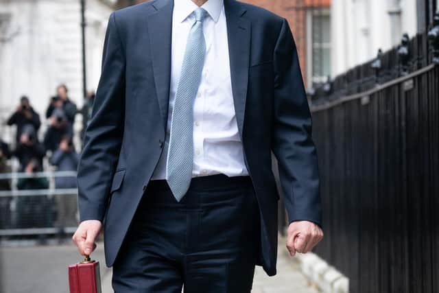 Chancellor of the Exchequer Jeremy Hunt leaves 11 Downing Street ahead of the Spring Budget