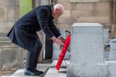 First Minister John Swinney lays a wreath during the Remembrance Sunday ceremony at the Stone of Remembrance outside the City Chambers in Edinburgh. (Picture: Jane Barlow/PA Wire)